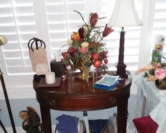 Demilune side table with decorations, etc. 