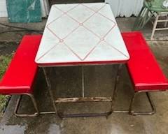 Enamel top table with fold out benches
