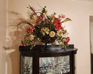 Large floral arrangement in metal basket