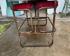 Enamel top table with benches folded up