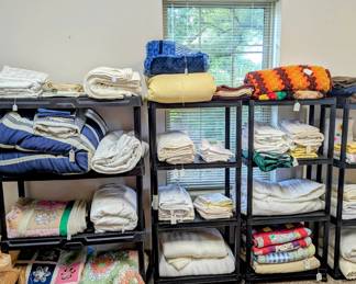 Lots of beautiful linens and quilts!