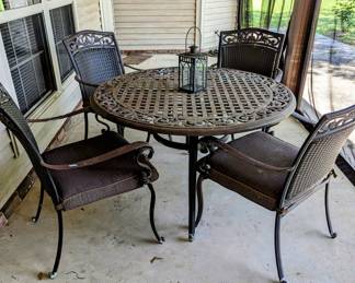 $220 - Metal and Woven Patio table and chairs.