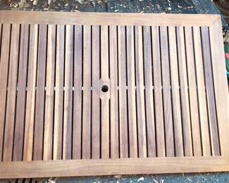 A teak & aluminum umbrella table and 6 chairs 