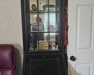 beautiful, curved curio cabinet  