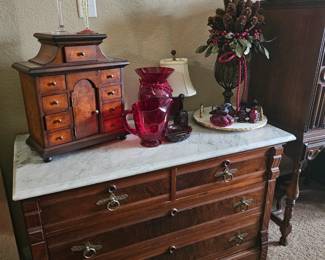 Marble top chest with decor