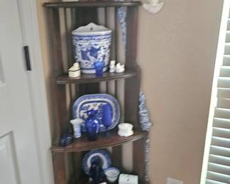 antique corner shelf with lots of beauty
