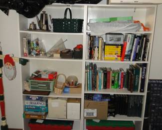 Shelving units filled with books and other assorted holiday items