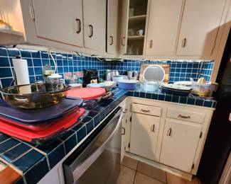 Full cabinets and countertops - serving dishes, storage dishes, small appliances, mixing bowls, etc