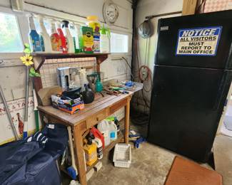 Garage refrigerator, potter's bench, garden supplies