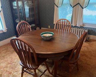 Solid round table and chairs…really nice set that will last many more years.  The wood grain on top is outstanding 