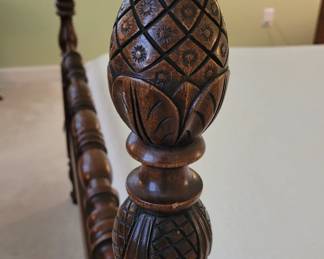 Carved design on full four poster bed