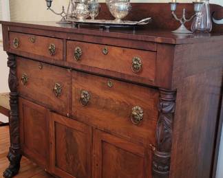 antique carved sideboard with brass handles