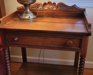Carved back single drawer small table with turned legs