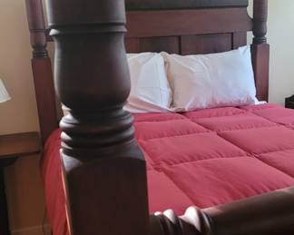 Close-up of antique four poster bed, very big and sturdy