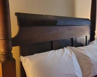 Close-up of antique four poster bed, very big and sturdy