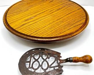 Antique 1882 Iron Trivet With Wood Handle & Vintage Wood Lazy Susan
Lot #: 98
