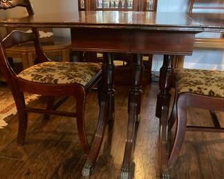 Duncan Phyfe table with two leaves and four chairs