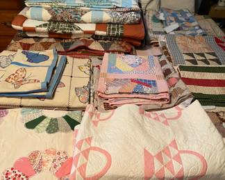 Huge collection of antique hand made quilts