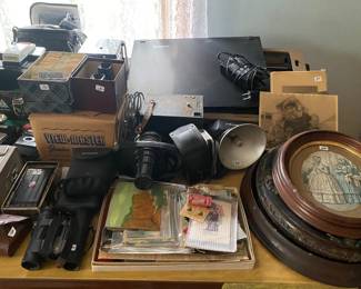 Antique and vintage cameras / oval framed antique wall art / vintage typewriter