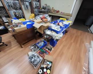 Drapery hardware and other tools and supplies.  We have two solid wood discs from the 50s.