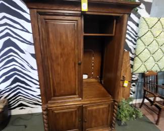 This is a distressed wood TV. Armoire by the Lane.