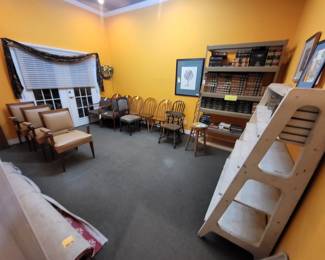 Is a variety of chairs all $25 or less?A stark rug loads of law books to decorate book shelves with and several shelves.