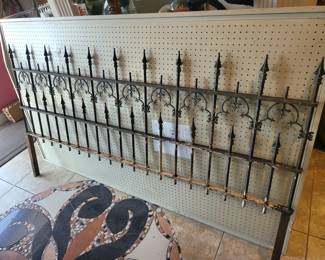 Antique Iron fencing made into an 80" headboard.  It has most recently been used as yard art.