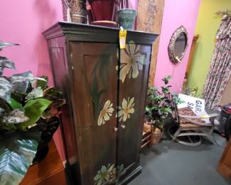 Small hand painted purple floral tv armoire could also be used and converted into a bar.