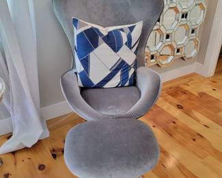 Pair of swivel chairs with ottomans