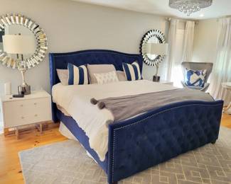 King Kattan Cobalt nailhead trim tufted bed, white nightsands, lamps, mirrors