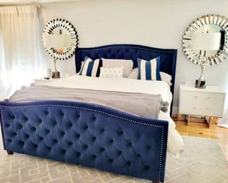 King Kattan Cobalt nailhead trim tufted bed, white nightsands, lamps, mirrors