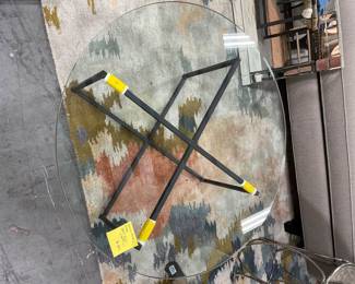 round 35" glass on metal frame  sitting on 9x12 modern rug pinks blues greys greens