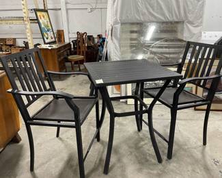 black metal highboy table with two chairs