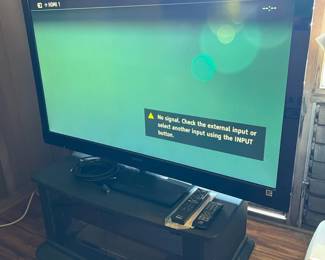 PPE005- Sony 52” LCD Tv With Tv Stand, JVC DVD Player & Remotes