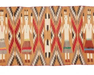 142
A Navajo Yei Pictorial Textile
Early/mid-20th century, Diné
Woven in ochre, grey, brown, red, black, and multicolored wool with four figures alternating with mirrored sawtooth columns and feather motifs, with banding to each end
21.5" H x 48" W
Estimate: $300 - $500
