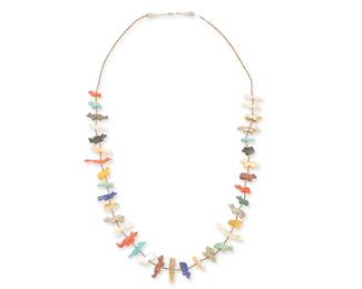 237
A Puebloan Multi-Stone Carved Fetish Necklace
Mid/late 20th century; Southwestern United States
A single strand necklace with various finely carved diminutive animals such as bears, turtles, birds, rabbits, and frogs, all in different stones including turquoise, coral, shell, lapis, and amber, with fine heishi spacers and silver metal cone terminals
31" L
Estimate: $400 - $600
