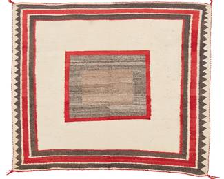 87
A Navajo Single Saddle Blanket
Circa 1920, Diné
Woven with red, natural grey, brown, and white wool with a central panel and banded border, with lazy lines throughout
32.75" H x 30" W
Estimate: $700 - $900