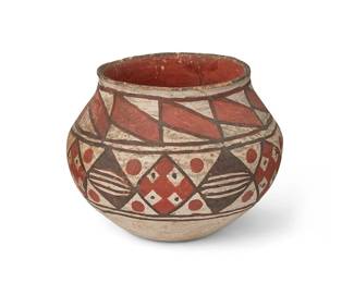 150
An Acoma/Laguna Pottery Olla
Early 20th century
The small three-color olla with banded diamond geometric motifs on white slip glaze
4.875" H x 6.25" Dia.
Estimate: $200 - $300