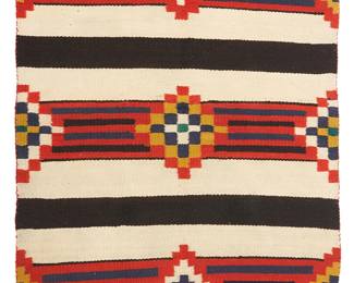 78
A Navajo Third Phase-Style Wearing Blanket
Early 20th century, Diné
Woven in red, blue, black, cream, and ochre wool with alternating stepped diamond and striped banding
42" H x 41.5" W
Estimate: $800 - $1,200