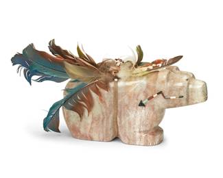 282
Alex Tsethlikai (B. 20th Century, Zuni Pueblo)
A large carved pink marble bear figure, late 20th century
With artist's cipher incised to underside: AT
The bear figure with inlaid heart line of shell, turquoise, and other stones, surmounted by a stone and vibrant feathers bound by a sinew band strung with shells and stones
With feathers: 7.5" H x 13.75" W x 4" D
Estimate: $200 - $400