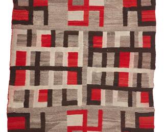 119
A Navajo Regional Rug
Early 20th century, Diné
With multiple whirling log motifs woven in red, brown, dark and light grey wool
91" H x 50" W
Estimate: $800 - $1,200