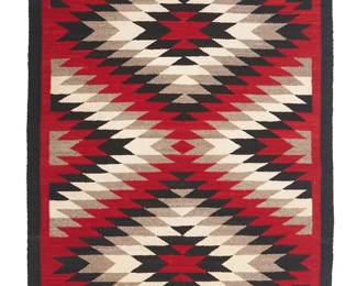 115
A Navajo Regional Rug
Mid-20th century, Diné
Featuring an eyedazzler motif with two conjoined serrated diamonds woven in red, black, grey, and cream wool
47" H x 32" W
Estimate: $300 - $500