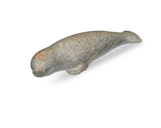 296
An Inuit Carved Stone Seal Figure
Mid/late 20th century
Incised signature to underside possibly reading: © Jerome Koezunr / 170
The seal with incised facial features and flipper details
2.125" H x 10" W x 2.875" D
Estimate: $300 - $500