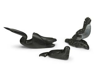 300
Three Inuit Carved Stone Figures
Three works:
Johnassie Eyaituq (b.1944, Inuit; Belcher Islands/Sanikiluaq)
A carved stone swimming loon figure, late 20th/early 21st century
Signed syllabically to underside
The bird with sgraffito feather and facial details
4.625" H x 9.625" W x 1.75" D
Charlie Eyaituq (b. 1967, Inuit; Belcher Islands/Sanikiluaq)
A small carved stone seal figure, early 21st century
Incised signature to underside: Charlie Eyaituq; with sticker: NS17 / canada / eskimo / art esquimau / 3
The seal with sgraffito facial and flipper details
2.75" H x 5.75" W x 1.625" D
Josie Iqaluq (b. 20th century, Inuit; Cape Dorset/Kinngait)
Two carved seal figures, early 21st century
Signed syllabically and in English: Josie Iqaluq
Depicting two seal figures in play, with sgraffito spots and facial details
6.25" H x 5.625" W x 2.5" D
3 pieces
Estimate: $400 - $600
