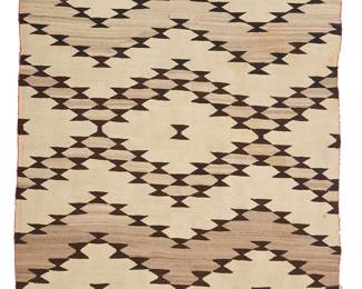 121
A Navajo Regional Rug
Early/mid-20th century, Diné
A barbed zigzag motif woven in dark brown and grey on cream wool
87" H x 56" W
Estimate: $800 - $1,200