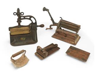 215
Four Cast Iron Fluting Irons
Late 19th century
One marked in the casting: Geneva.Ill / Geneva Hand Fluter; another marked: Dudley Fluter / Pat Nov 14 1976 / another marked: American / Pat Aug 19 1979; another marked: Patd Augt 21. 1886. / Heat This
Comprising four variations of fluting irons, one with brass rollers, each used to create fluted trim in garments, 4 pieces
Largest: 11.5" H x 11.75" W x 5.125" D; Smallest: 2.875" H x 7.25" W x 3.5" D
Estimate: $400 - $600