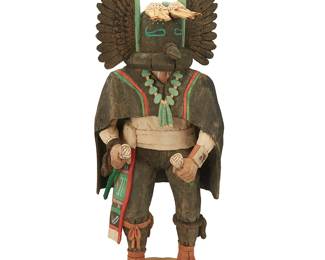 18
Stetson Honyumptewa (B. 1959, Hopi-Tewa)
A Hopi angwusi katsina doll, 1988
Signed and dated to underside: Stetson Honyumptewa / 88; further marked: Penasco N Mx / 87553 / Angwusi (Crow) / Hopi Moenkopi AZ
The polychrome painted carved wood crow masked figure depicted with turquoise necklace and holding two whips
17.125" H x 6.125" W x 5.5" D
Estimate: $500 - $700