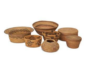58
A Large Group Of Native American Basketry
Early/mid-20th century
Seven coiled baskets including two dichromatic Papago small bowls, each with stepped motifs (larger: 3.5" H x 6.5" Dia; smaller: 3" H x 6" W), two shallow lidded round baskets (larger: 3.5" H x 8" Dia.; smaller: 3" H x 5.5" Dia.), a small tapered globular bowl (3.5" H x 5.5" Dia.), a large polychrome basketry bowl with striped bands (5.25" H x 11" Dia.), and a hat-shaped basket with flared rim and checkered band (4" H x 11.25" W), 7 pieces
Estimate: $400 - $600