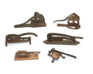 214
A Group Of Cast Iron Tobacco Plug Cutters
Late 19th century
One marked in the casting: Champion knife / Enterprise Mfg. Co. Philada; another marked: Venable's Ole Varginy; another marked: The Prize Cutter By E. Lee.; another marked: Good Chew / Coolest Smoke ever put in a pipe; another marked: Ranney-Davis Mercantile Co / Arkansas City Kans.
Comprising six variations of countertop tobacco plug cutters, 6 pieces
Largest: 7.5" H x 15.25" W x 4" D; Smallest: 3" H x 10" W x 2.375" W
Estimate: $400 - $600