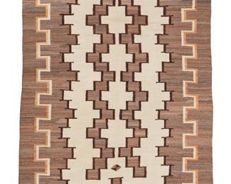 97
A Large Navajo Regional Rug
Early 20th century, Diné
Woven in cream, grey, tan, and dark brown wool with a central stepped conjoined column motif and stepped border
110" H x 63" W
Estimate: $1,000 - $1,500